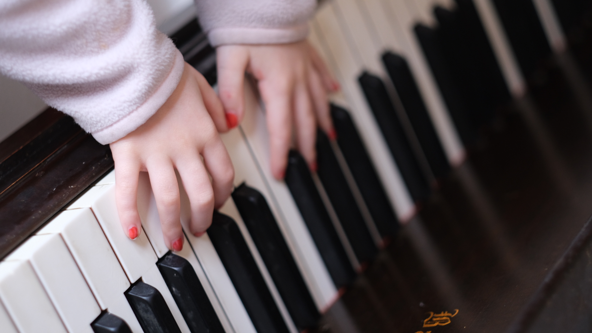 Hands playing the piano